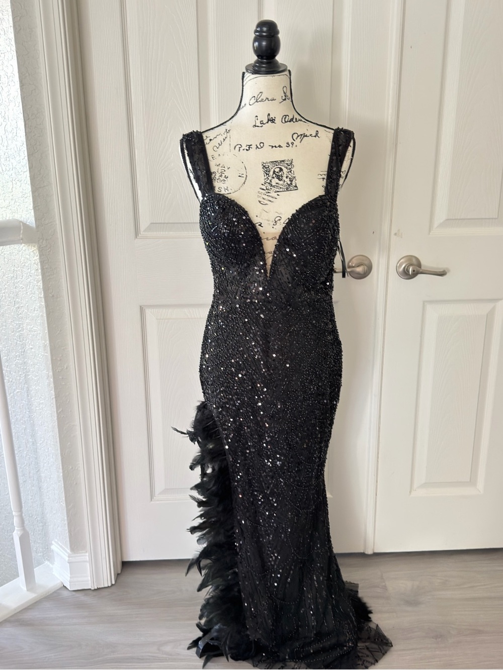 Elegant Black Sequin Evening Gown with Feather Trim